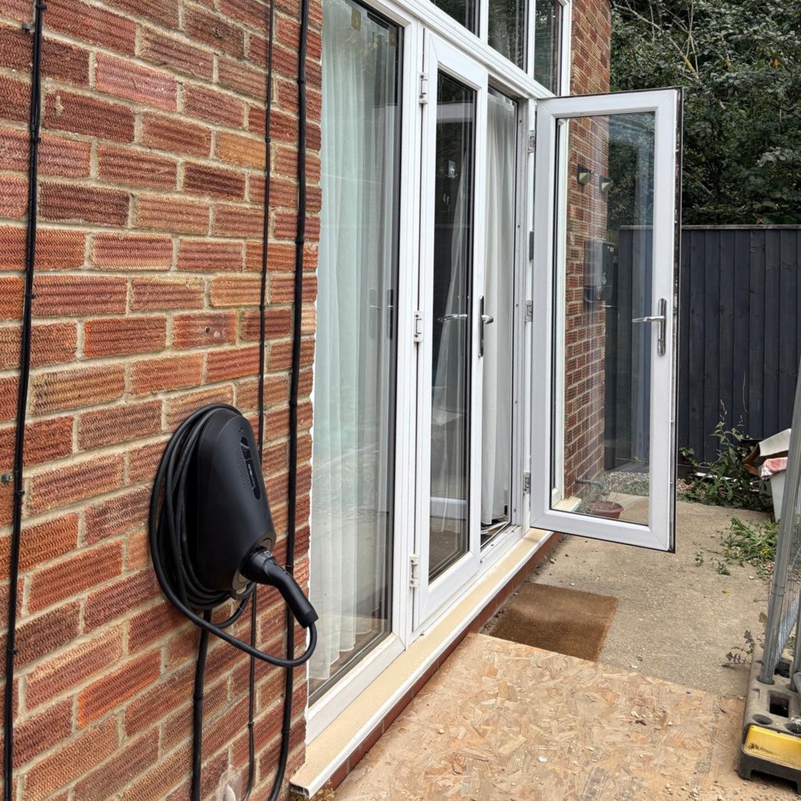 Zappi EV charger mounted beside patio doors on a Lincolnshire home